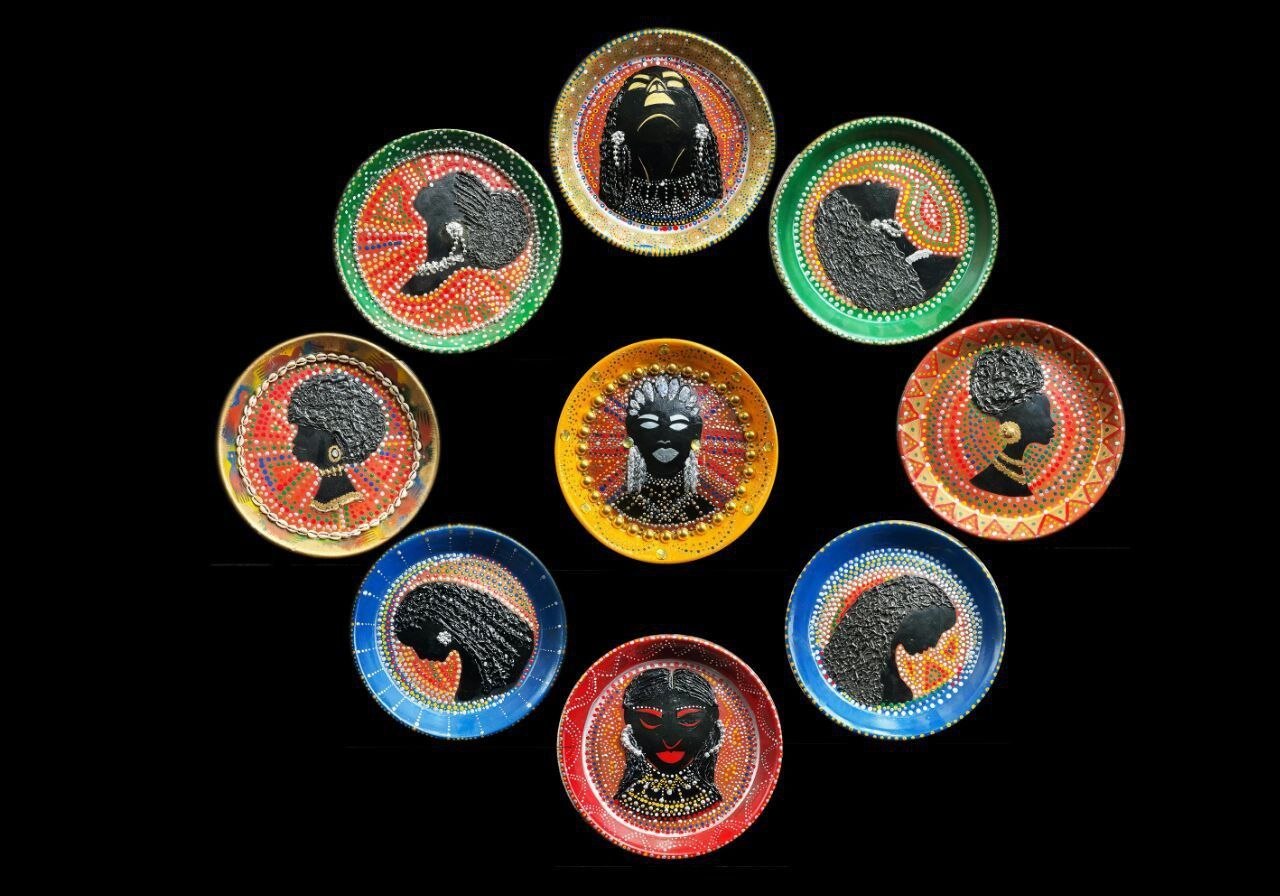 Nine circular portrait objects arranged together against a black background